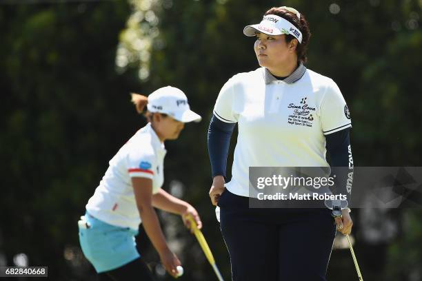 Miki Sakai of Japan looks on after her putt on the 18th green during the final round of the Hoken-no-Madoguchi Ladies at the Fukuoka Country Club...