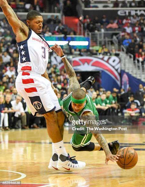 Washington Wizards guard Bradley Beal is called for a foul as Boston Celtics guard Isaiah Thomas drives the ball during game six of the Eastern...