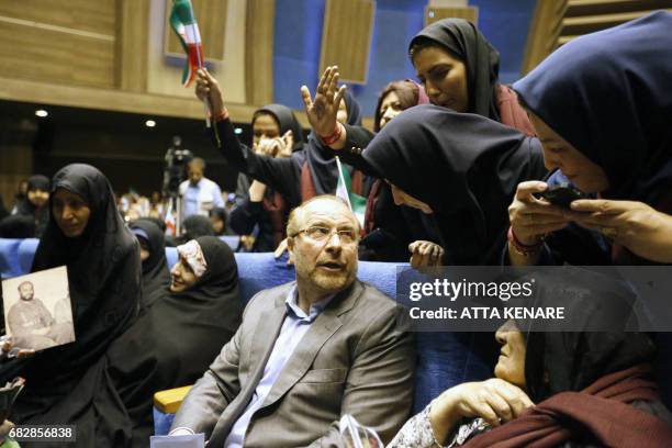 Iranian conservative presidential candidate and Tehran mayor Mohammad Bagher Ghalibaf talks with supporters during a campaign rally in the Iranian...