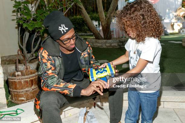 Actor Nick Cannon and Moroccan Scott Cannon attend the Moroccan Scott Cannon and Monroe Cannon Party on Mary 13 in Los Angeles, California.