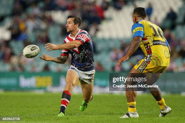 Mitchell Pearce of the Roosters passes during the round 10 NRL match between the Sydney Roosters and the Parramatta Eels at Allianz Stadium on May...