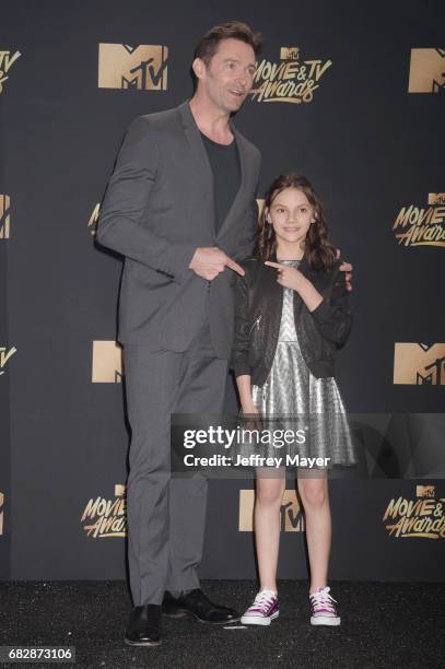 Actors Hugh Jackman and Dafne Keen pose in the press room at the 2017 MTV Movie and TV Awards at The Shrine Auditorium on May 7, 2017 in Los Angeles,...