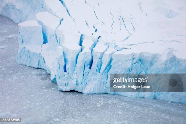 overhead of glacier shelf with blue ice - ice shelf stock-fotos und bilder