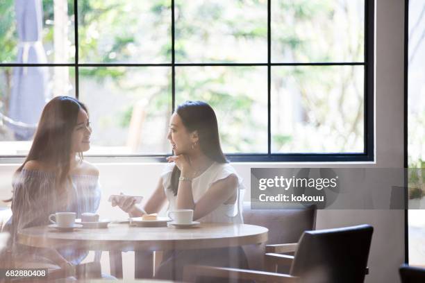 Two Girls And A Chocolate Cake And Cheesecake A Nice Breakfast High-Res Stock Photo