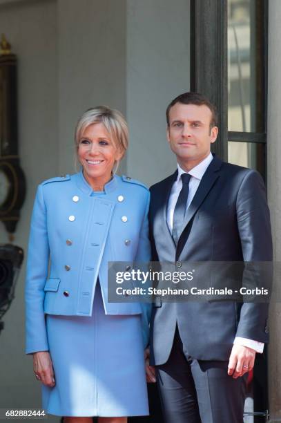 French newly elected President Emmanuel Macron poses with his Wife Brigitte Macron at the Elysee presidential Palace after the handover ceremony with...