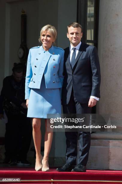 French newly elected President Emmanuel Macron poses with his Wife Brigitte Macron at the Elysee presidential Palace after the handover ceremony with...