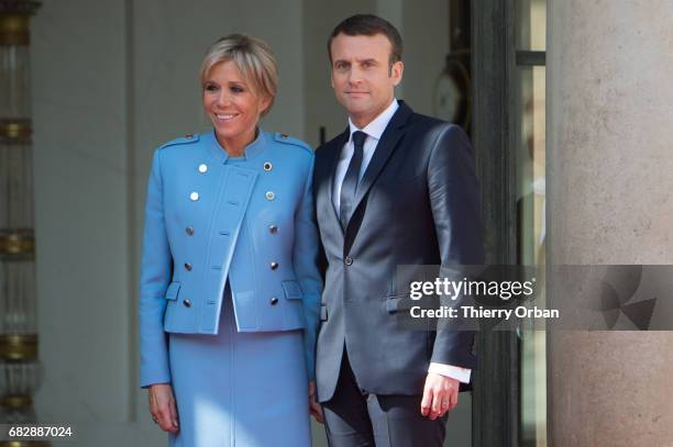French newly elected President Emmanuel Macron poses with his Wife Brigitte Macron at the Elysee presidential Palace after the handover ceremony with...