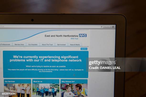 This photograph, posed as an illustration on May 12 shows the website of the NHS: East and North Hertfordshire notifying users of a problem in its...