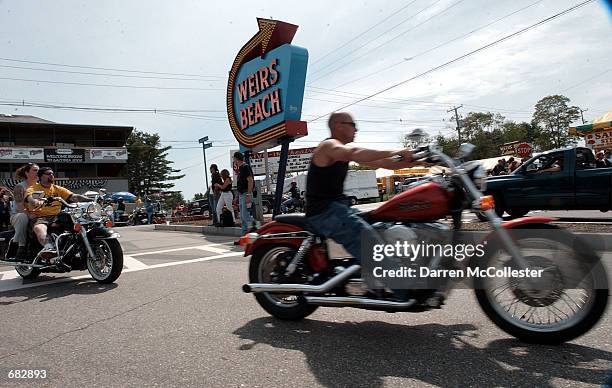 Motorcycle riders cruise into Weirs Beach on June 8, 2002 during the first day of Bike Week in Laconia, New Hampshire. Police have heightened...