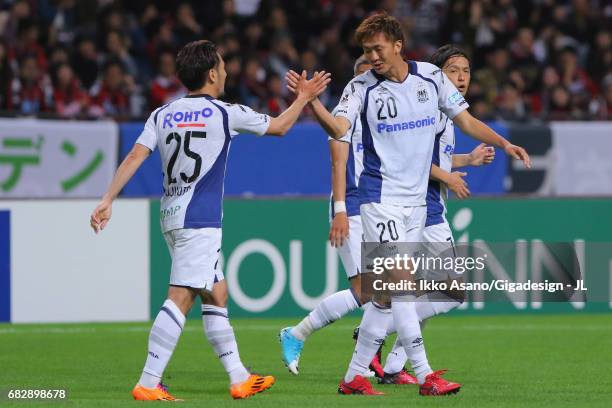 Jungo Fujimoto of Gamba Osaka celebrates scoring the opening goal with his team mate Shun Nagasawa during the J.League J1 match between Consadole...