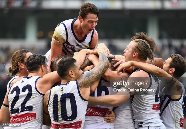 David Mundy of the Dockers is congratulated by team mates after kicking the winning goal during the round eight AFL match between the Richmond Tigers...