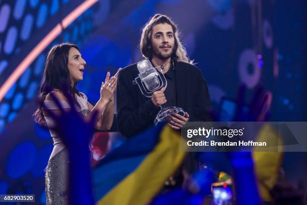 Salvador Sobral , the contestant from Portugal, receives the trophy after being announced as the winner from last year's winner Jamala at the...