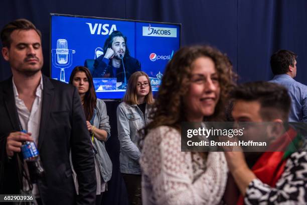 Salvador Sobral, the winning contestant from Portugal, is seen on a television screen during the winner's press conference at the Eurovision Grand...