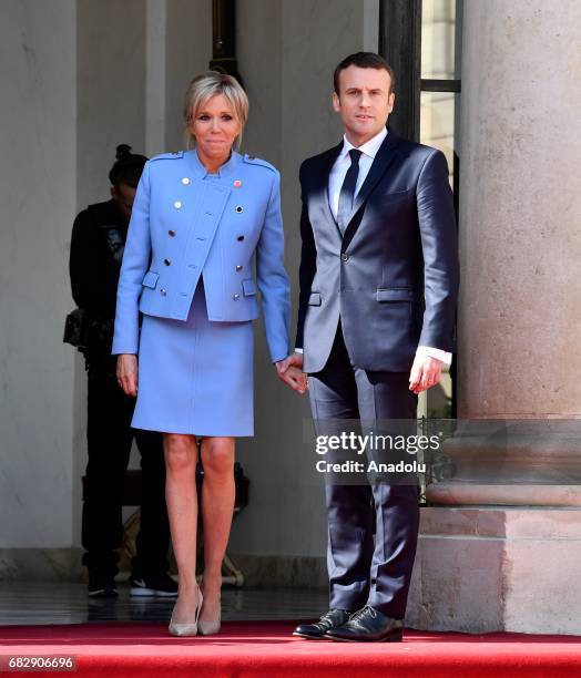 New French president Emmanuel Macron and his wife Brigitte Trogneux Macron pose after the handover ceremony at the Elysee Palace in Paris, France on...