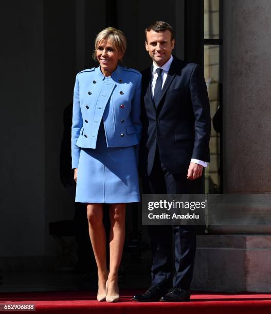 New French president Emmanuel Macron and his wife Brigitte Trogneux Macron pose after the handover ceremony at the Elysee Palace in Paris, France on...