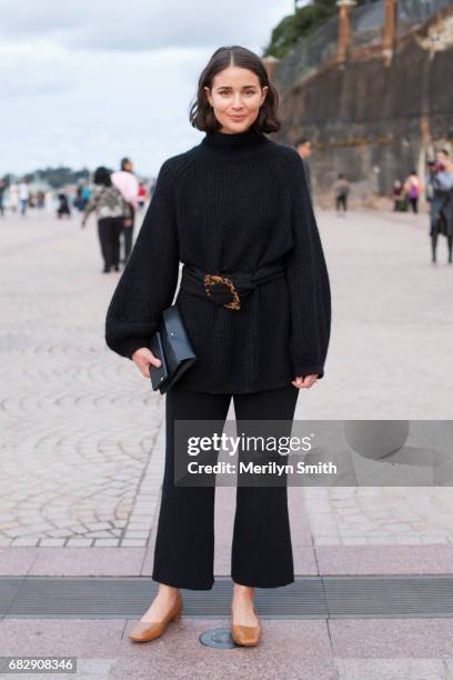 Fashion Blogger Sarah Donaldson is wearing a Cos sweater and bag, By far shoes and Theory pants at Sydney Opera House on May 14, 2017 in Sydney,...