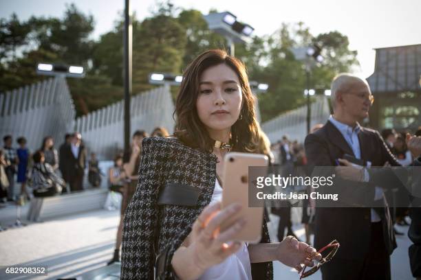 Janice Man takes a selfie before attending the Louis Vuitton Resort 2018 show at the Miho Museum on May 14, 2017 in Koka, Japan.