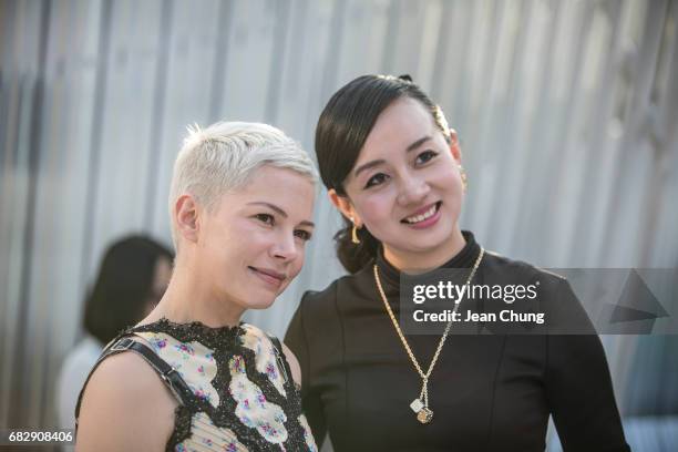 Michelle Williams, left, attends the Louis Vuitton Resort 2018 show at the Miho Museum on May 14, 2017 in Koka, Japan.