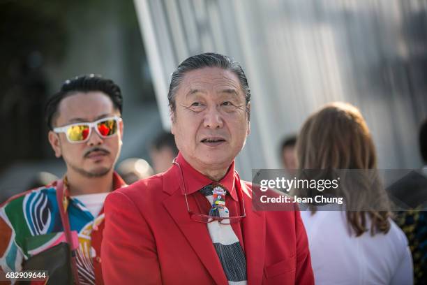 Kansai Yamamoto, center, attends the Louis Vuitton Resort 2018 show at the Miho Museum on May 14, 2017 in Koka, Japan.