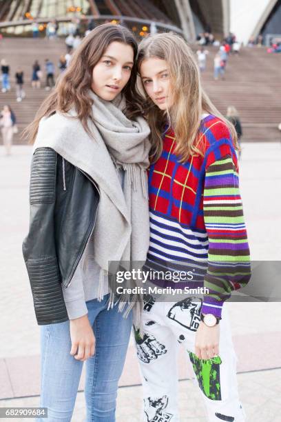 Model Stephanie Fields is wearing Frame Denim and Model Georgie Perkins is wearing a vintage Versace sweater and Emma Mulholland jeans at Sydney...