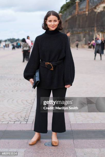 Fashion Blogger Sarah Donaldson is wearing a Cos sweater and bag, By far shoes and Theory pants at Sydney Opera House on May 14, 2017 in Sydney,...