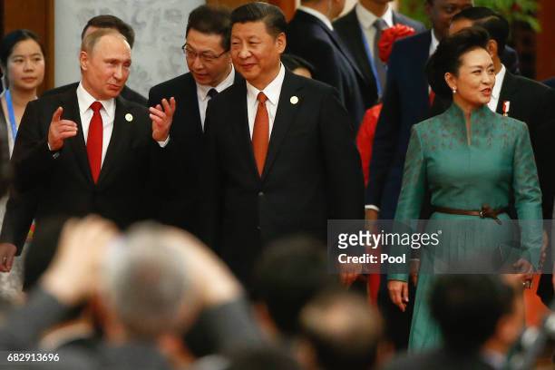 Chinese President Xi Jinping, his wife Peng Liyuan and Russian President Vladimir Putin arrive for the welcoming banquet for the Belt and Road Forum...