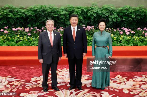 Chinese President Xi Jinping and wife Peng Liyuan welcome U.N. Secretary-General Antonio Guterres at the welcoming banquet for the Belt and Road...