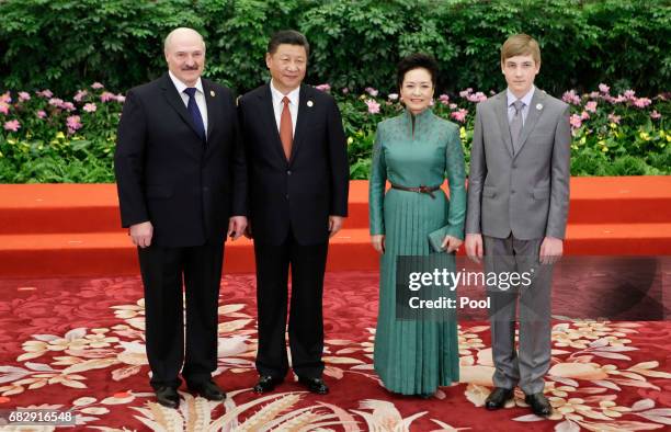 Chinese President Xi Jinping and wife Peng Liyuan welcome Belarus President Alexander Lukashenko and his son Nikolai at the welcoming banquet for the...