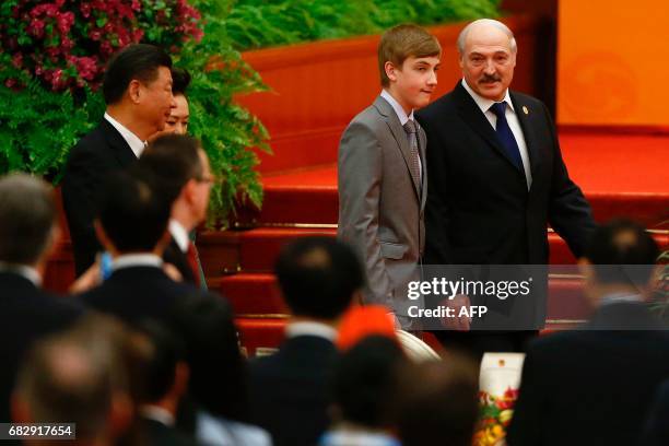 Belarus President Alexander Lukashenko and his son Nikolai arrive for the welcoming banquet for the Belt and Road Forum at the Great Hall of the...
