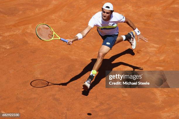 Matteo Berrettini of Italy stretches for a return during his first round match against Fabio Fognini of Italy on Day Two of The Internazionali BNL...