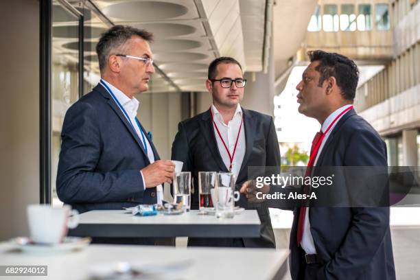 business people on a coffee break - open collar stock pictures, royalty-free photos & images