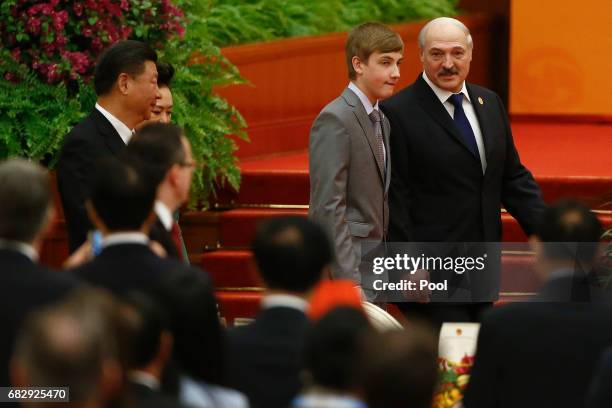 Belarus President Alexander Lukashenko and his son Nikolai arrive for the welcoming banquet for the Belt and Road Forum at the Great Hall of the...