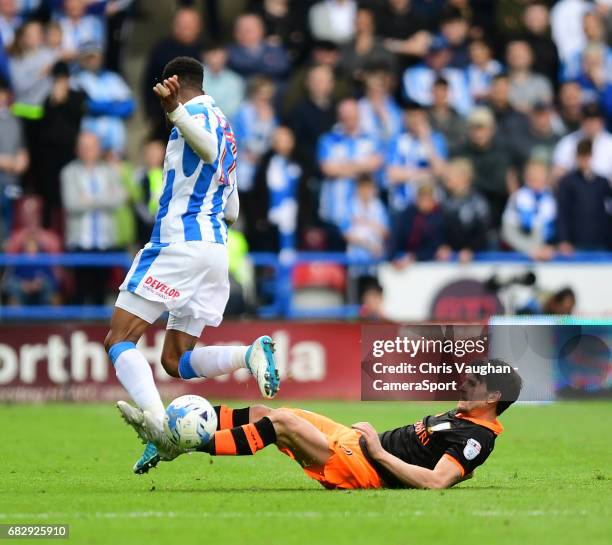 Huddersfield Town's Rajiv van La Parra is tackled by Sheffield Wednesday's Kieran Lee during the Sky Bet Championship Play-Off Semi Final First Leg...