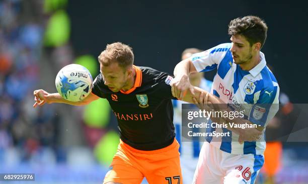 Sheffield Wednesday's Jordan Rhodes shields the ball from Huddersfield Town's Christopher Schindler during the Sky Bet Championship Play-Off Semi...