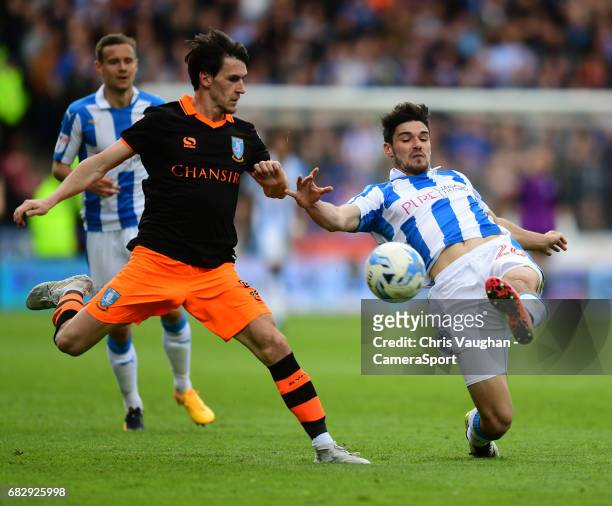Sheffield Wednesday's Kieran Lee is tackled by Huddersfield Town's Christopher Schindler during the Sky Bet Championship Play-Off Semi Final First...