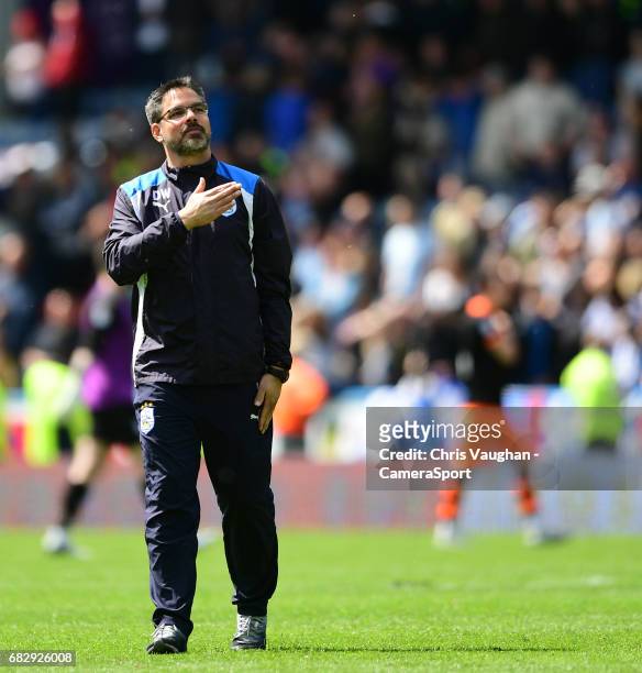 Huddersfield Town manager David Wagner taps the club badge on his top after the game during the Sky Bet Championship Play-Off Semi Final First Leg...