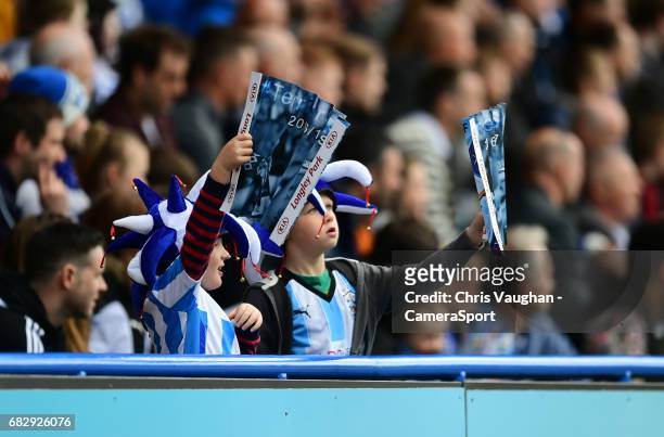 Two young Huddersfield Town fans cheer on their side during the Sky Bet Championship Play-Off Semi Final First Leg match between Huddersfield Town...