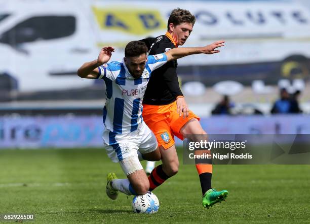 Tommy Smith of Huddersfield Town is fouled by Adam Reach of Sheffield Wednesday during the Sky Bet Championship Play Off Semi Final 1st leg match...