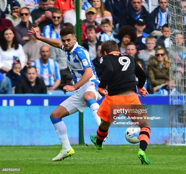 Huddersfield Town's Tommy Smith blocks a shot from Sheffield Wednesday's Adam Reach during the Sky Bet Championship Play-Off Semi Final First Leg...