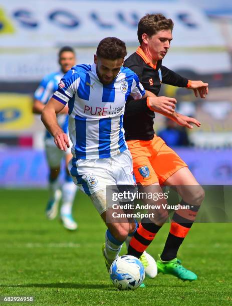 Huddersfield Town's Tommy Smith vies for possession with Sheffield Wednesday's Adam Reach during the Sky Bet Championship Play-Off Semi Final First...