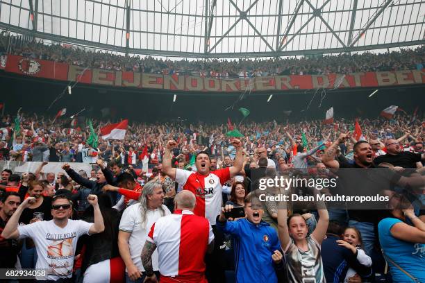 Fans of Feyenoord Rotterdam celebrate their team scoring a goal during the Dutch Eredivisie match between Feyenoord Rotterdam and SC Heracles Almelo...