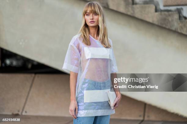 Annabella Barber wearing a sheer top Surrounded by the ghosts and denim jeans outside Dion Lee during Mercedes-Benz Fashion Week Resort 18...