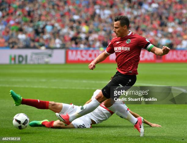 Edgar Prib of Hannover is challenged by Benjamin Pavard of Stuttgart during the Second Bundesliga match between Hannover 96 and VfB Stuttgart at...