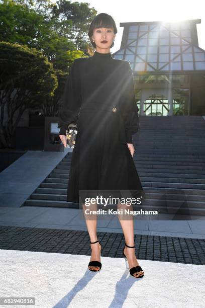 Actress Shioli Kutsuna poses for photographs during the Louis Vuitton Resort 2018 show at the Miho Museum on May 14, 2017 in Koka, Japan.