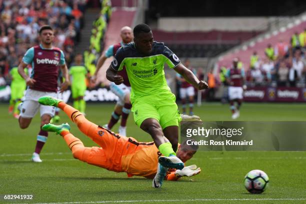 Daniel Sturridge of Liverpool scores his sides first goal by rounding Adrian of West Ham United during the Premier League match between West Ham...