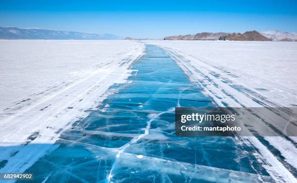 ice surface of baikal lake - lake baikal stock pictures, royalty-free photos & images