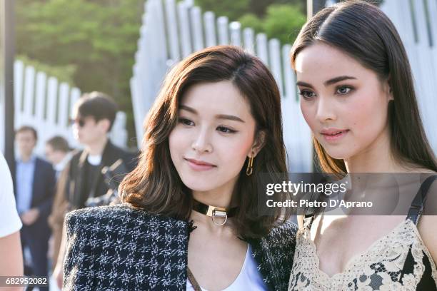 Janice Man and Urassaya Sperbund attend the Louis Vuitton Resort 2018 show at the Miho Museum on May 14, 2017 in Koka, Japan.