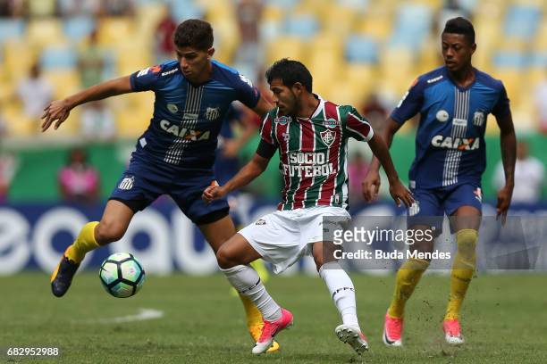 Junior Sornoza of Fluminense struggles for the ball with Vitor Bueno of Santos during a match between Fluminense and Santos as part of Brasileirao...