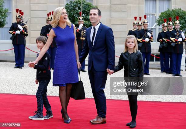 Emmanuel Macron's step-daughter Laurence Auziere-Jourdan , her husband Guillaume Jourdan and their children arrive at the Elysee Presidential Palace...