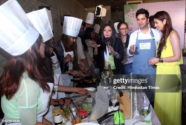 Chef Kunal Kapur and celebrity nutritionist Pooja Makhija during the launch of Saffola Aura - the new Super Oil with Olive Oil and Flaxseed Oil, at...